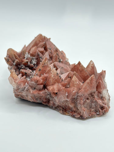 Pink Dog Tooth Calcite cluster with Hematite/Quartz